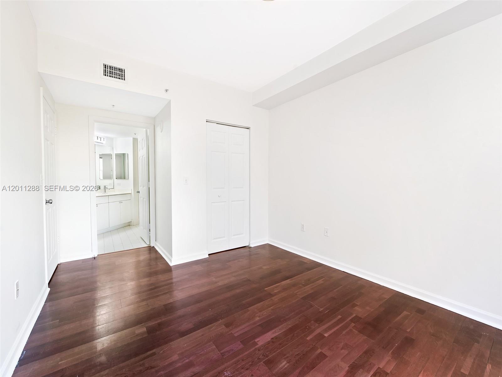 17100 North Bay Road, Unit 1614 Sunny Isles Beach, FL 33160 - Photo 9 of 17 a view of a hallway with wooden floor