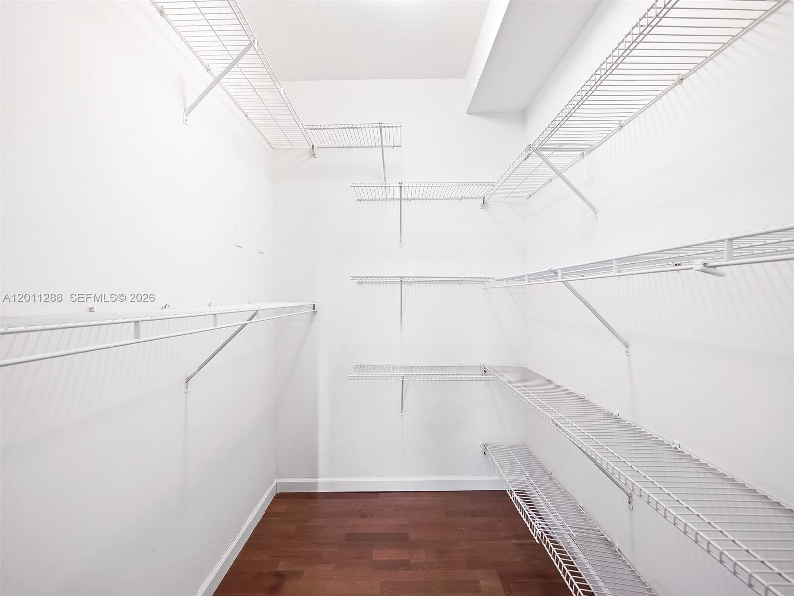 17100 North Bay Road, Unit 1614 Sunny Isles Beach, FL 33160 - Photo 10 of 17 a view of a room with racks on the wall