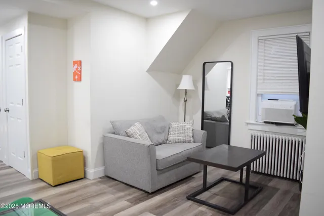 a living room with furniture and a table