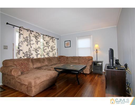 9 Cannon Road East Brunswick, NJ 08816 - Photo 3 of 7 a living room with furniture and wooden floor