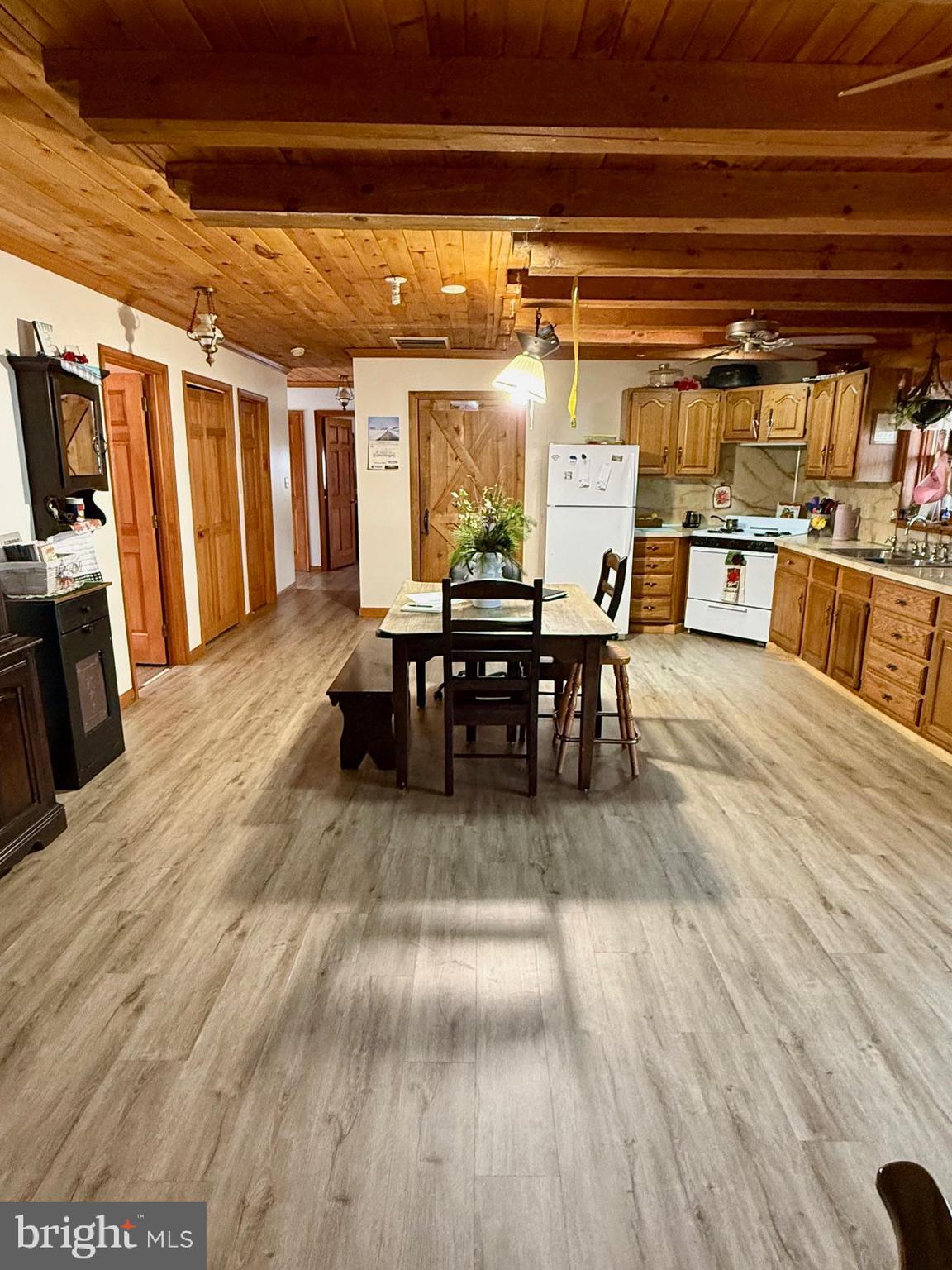 236 Fremont Road Nottingham, PA 19362 - Photo 18 of 34 a dining room with wooden floor a glass table and chairs