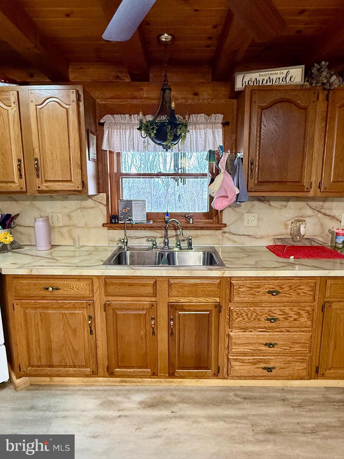 236 Fremont Road Nottingham, PA 19362 - Photo 22 of 34 a kitchen with granite countertop wooden cabinets and a sink