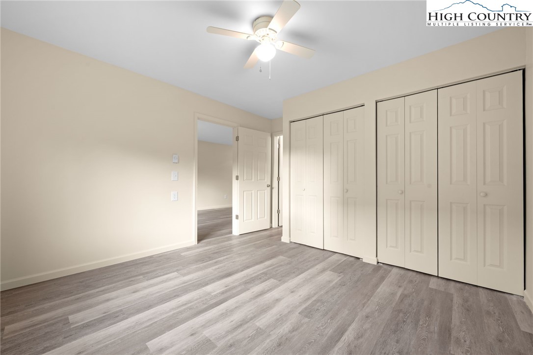 128 Zeb Street, Unit A101 Boone, NC 28607 - Photo 18 of 32 a view of empty room with wooden floor