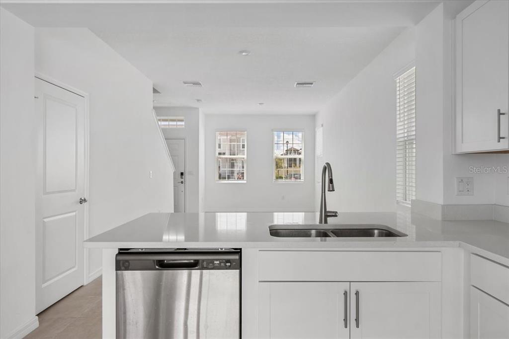 6338 Fairmont Lane Palmetto, FL 34221 - Photo 13 of 39 a view of kitchen with cabinets and window