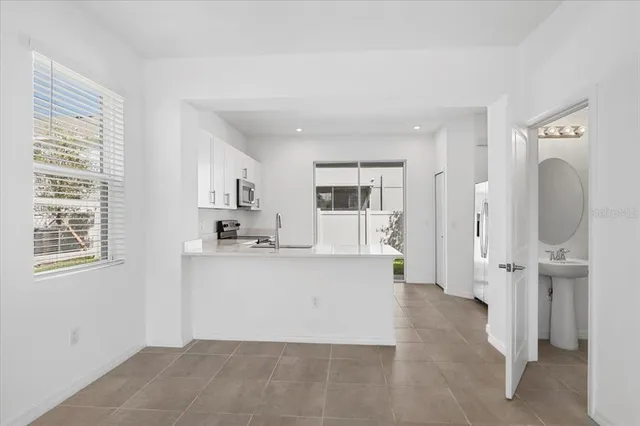 a view of a kitchen with a sink