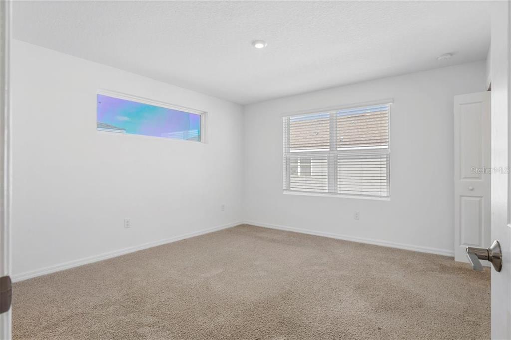 6338 Fairmont Lane Palmetto, FL 34221 - Photo 17 of 39 an empty room with windows