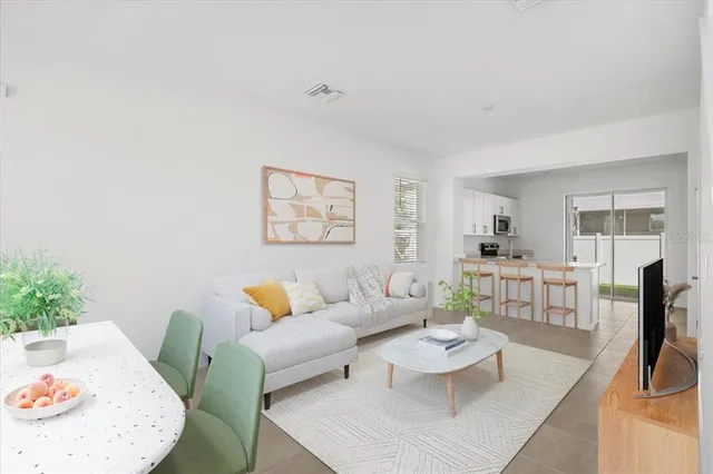 a living room with furniture and a table