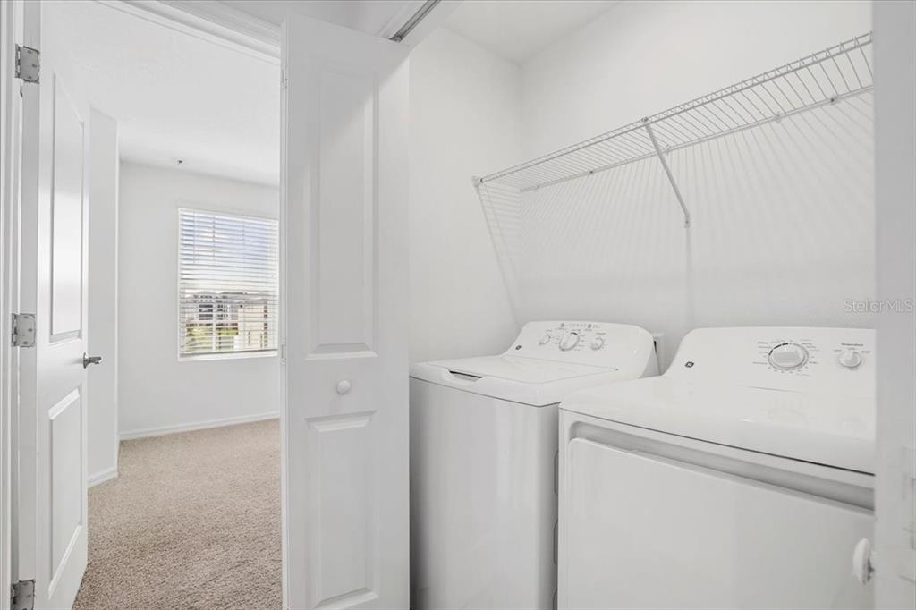 6338 Fairmont Lane Palmetto, FL 34221 - Photo 21 of 39 a view of storage and utility room with washer and dryer