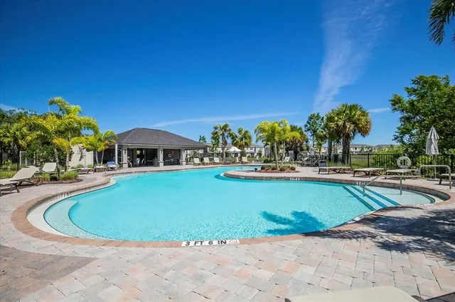a view of pool with outdoor seating