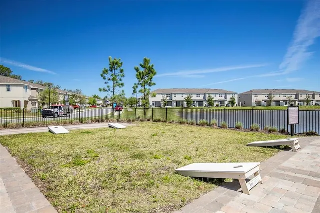a view of swimming pool with lawn chairs and outdoor seating