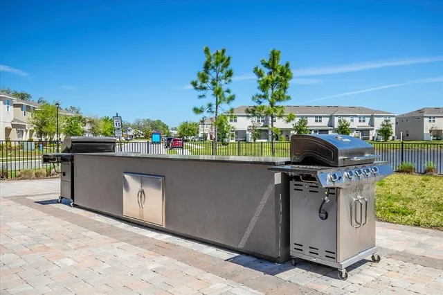 a view of a outdoor kitchen with a stove