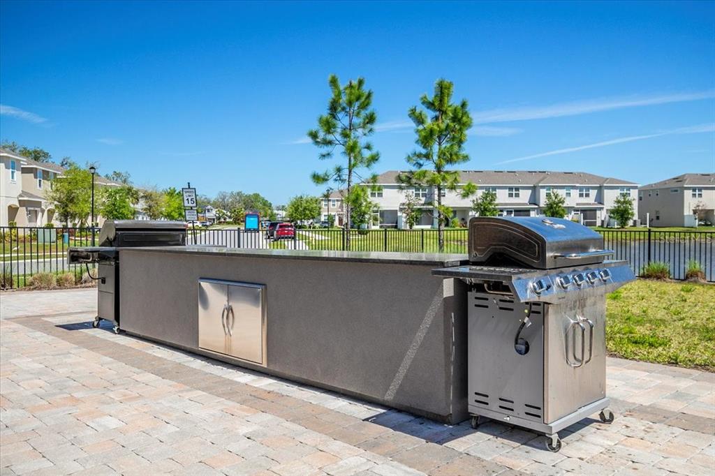 6338 Fairmont Lane Palmetto, FL 34221 - Photo 32 of 39 a view of a outdoor kitchen with a stove