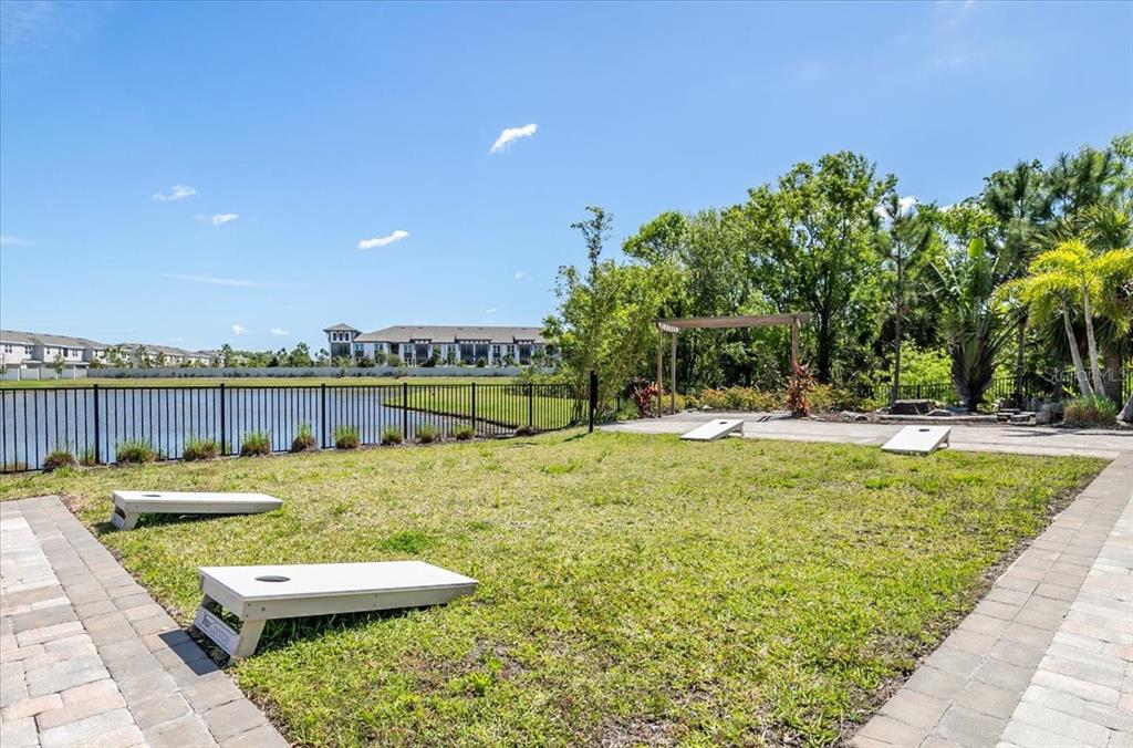 6338 Fairmont Lane Palmetto, FL 34221 - Photo 33 of 39 a view of a swimming pool with an outdoor space and seating area