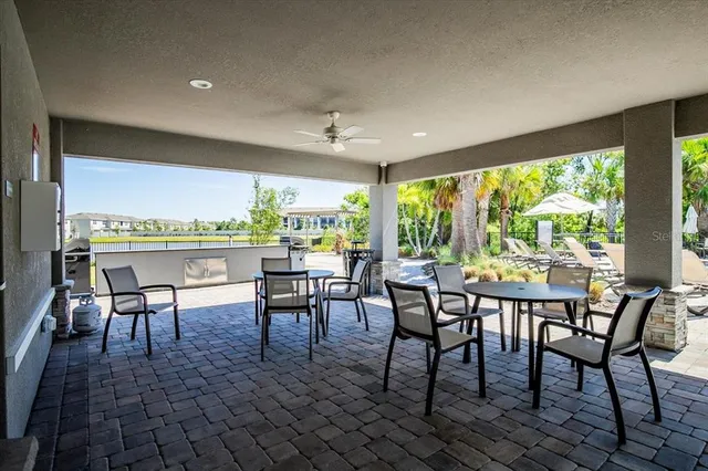 a view of a dining room with furniture window and outside view