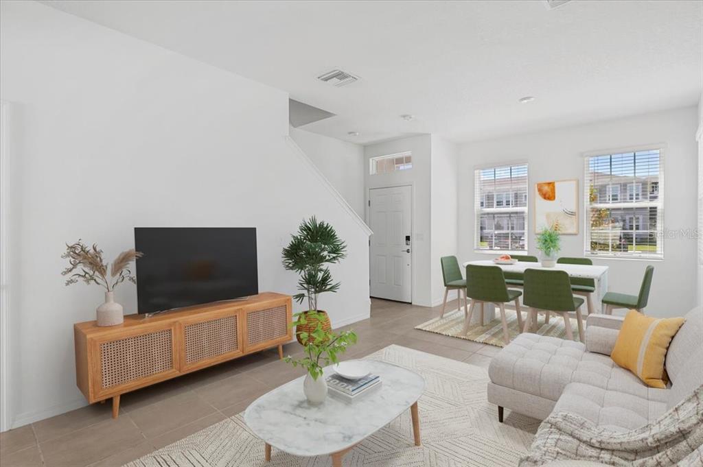 6338 Fairmont Lane Palmetto, FL 34221 - Photo 39 of 39 a living room with furniture and a flat screen tv