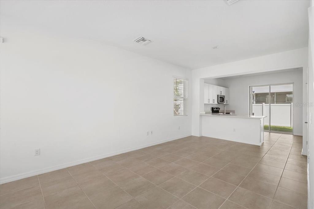 6338 Fairmont Lane Palmetto, FL 34221 - Photo 7 of 39 a view of empty room with wooden floor