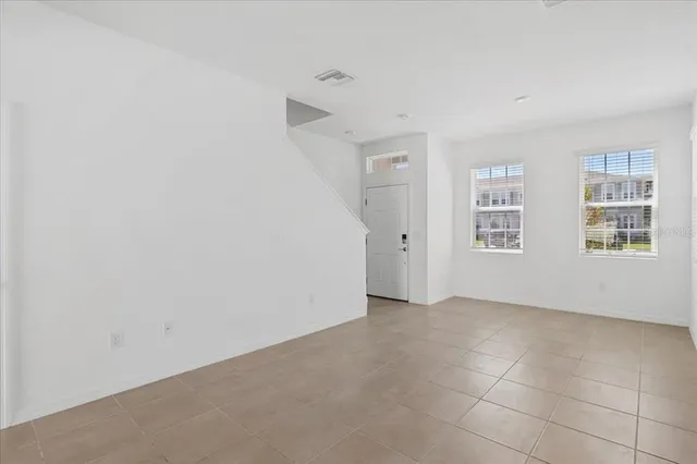 an empty room with windows