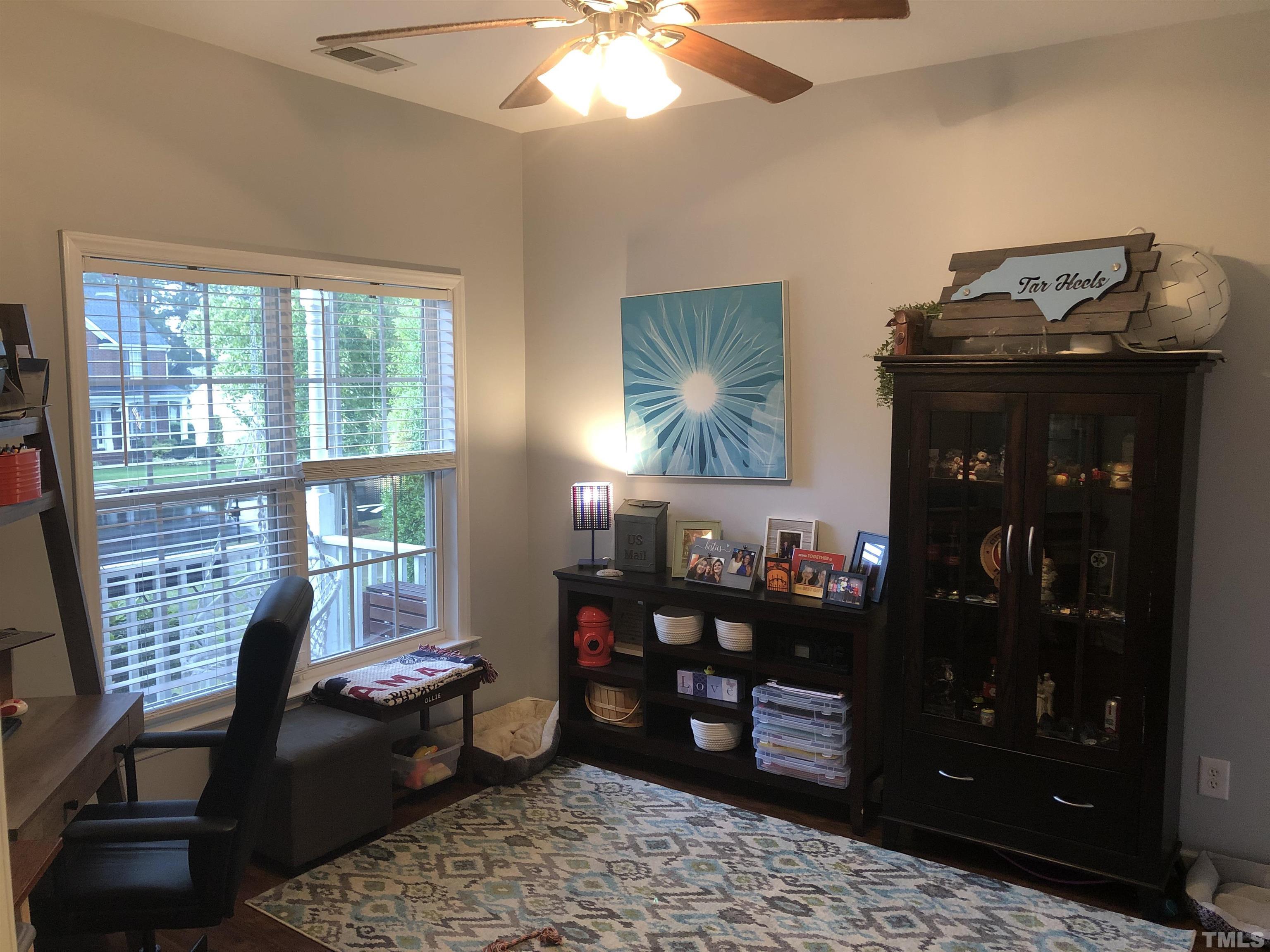 437 Seastone Street Raleigh, NC 27603 - Photo 17 of 30 a living room with furniture and a window
