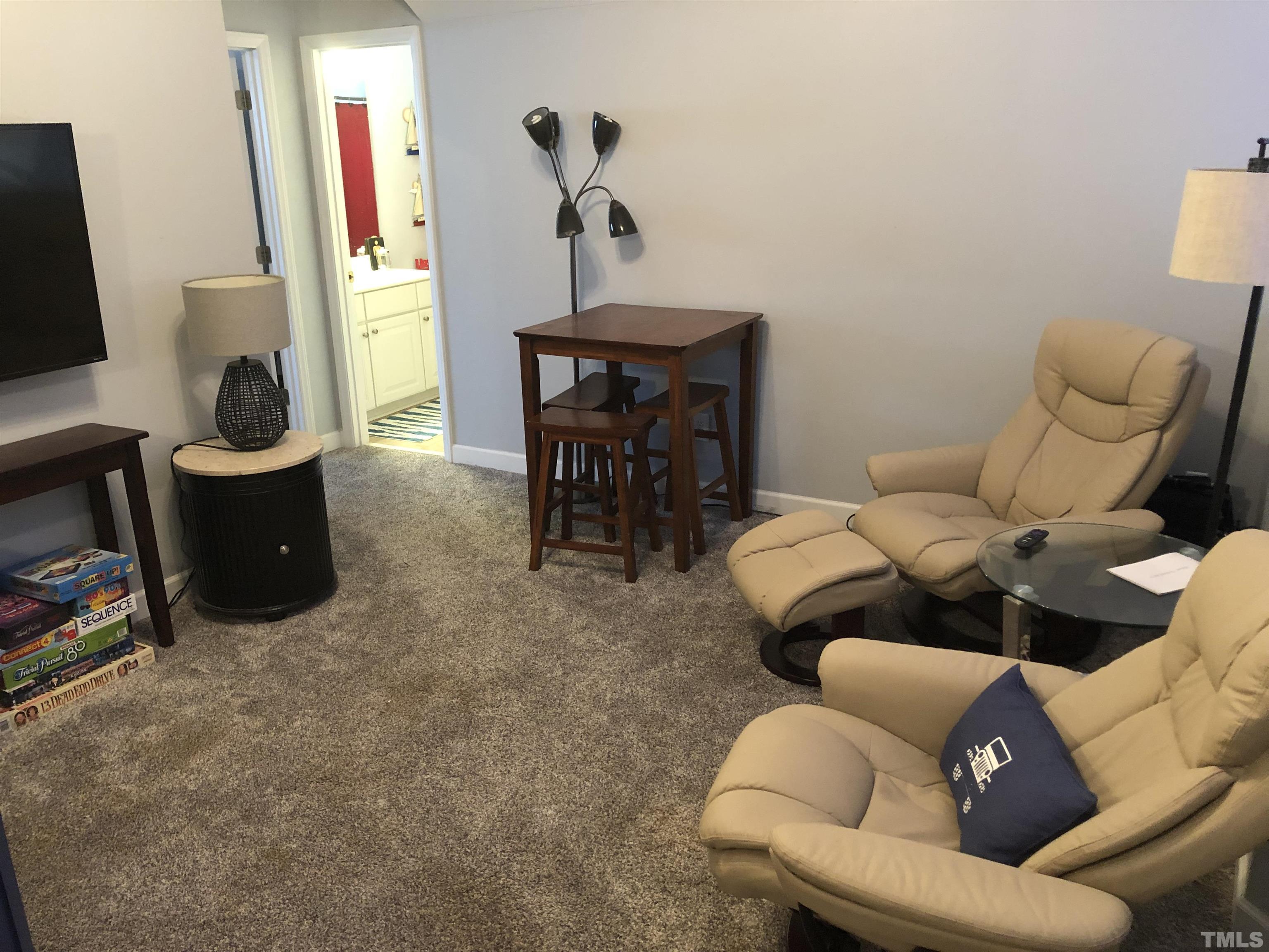 437 Seastone Street Raleigh, NC 27603 - Photo 21 of 30 a living room with furniture and a flat screen tv