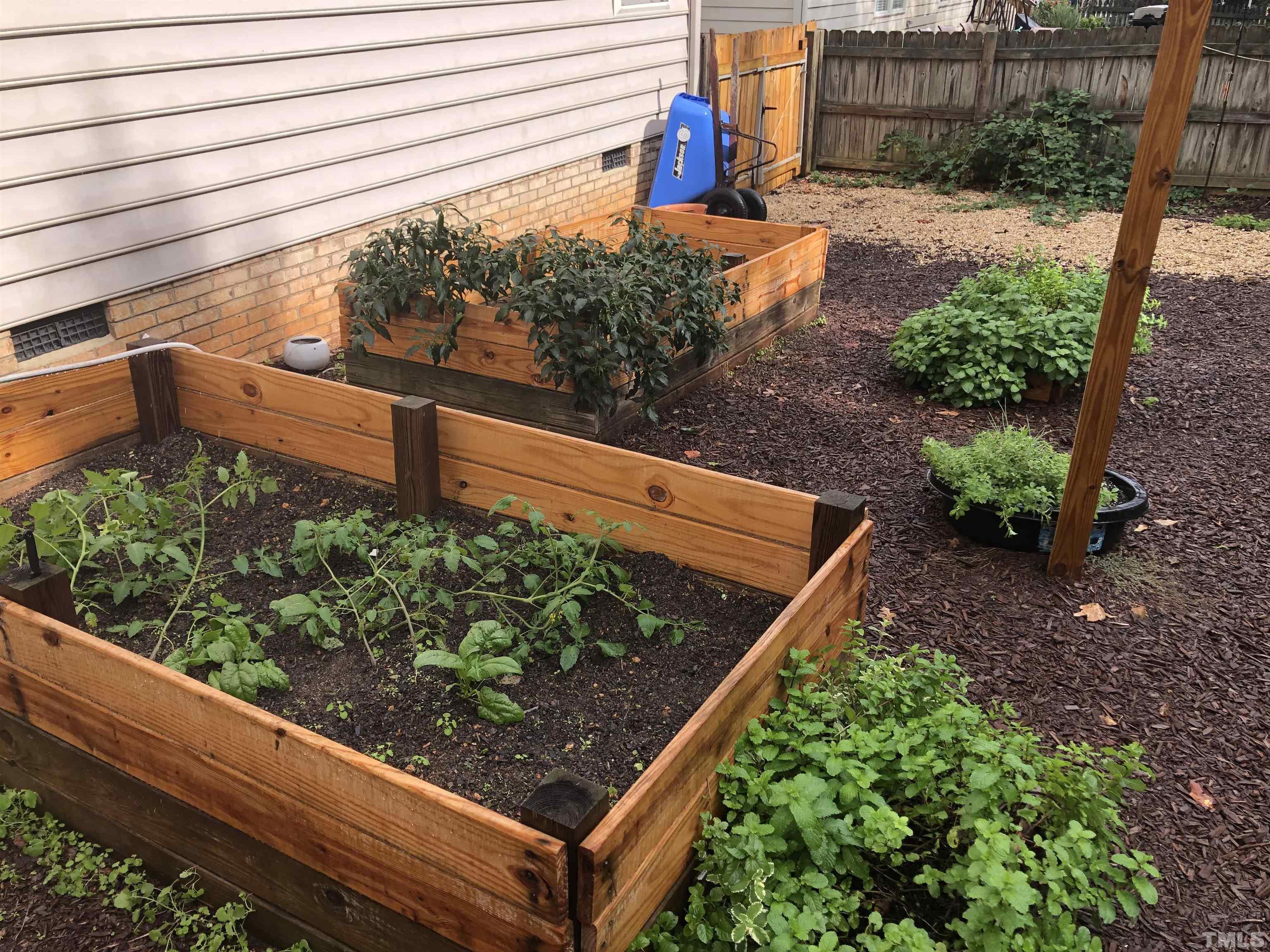 437 Seastone Street Raleigh, NC 27603 - Photo 29 of 30 a view of a yard with wooden fence