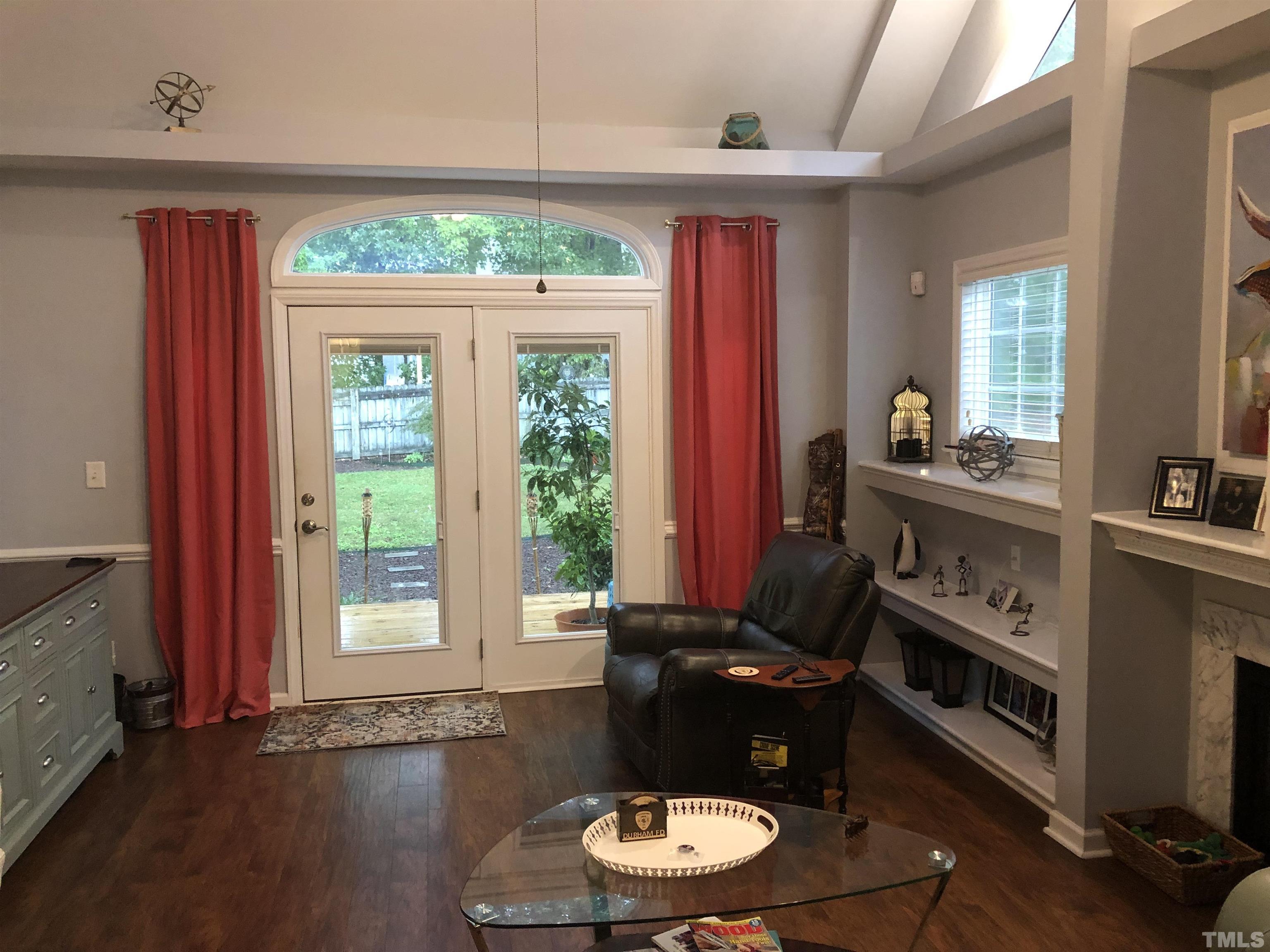 437 Seastone Street Raleigh, NC 27603 - Photo 7 of 30 a room with furniture and a fireplace