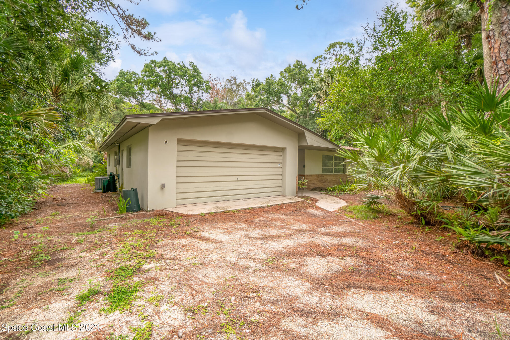 6686 Flamingo Road Melbourne Village, FL 32904 - Photo 29 of 30 a house with a yard