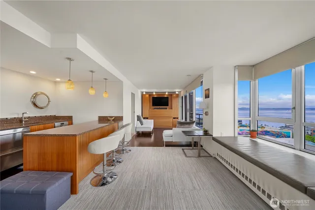 a room with a table chairs and a chandelier