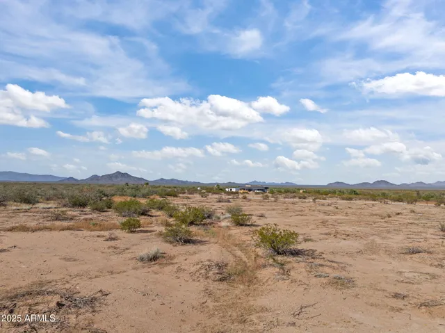 a view of an ocean and a mountain