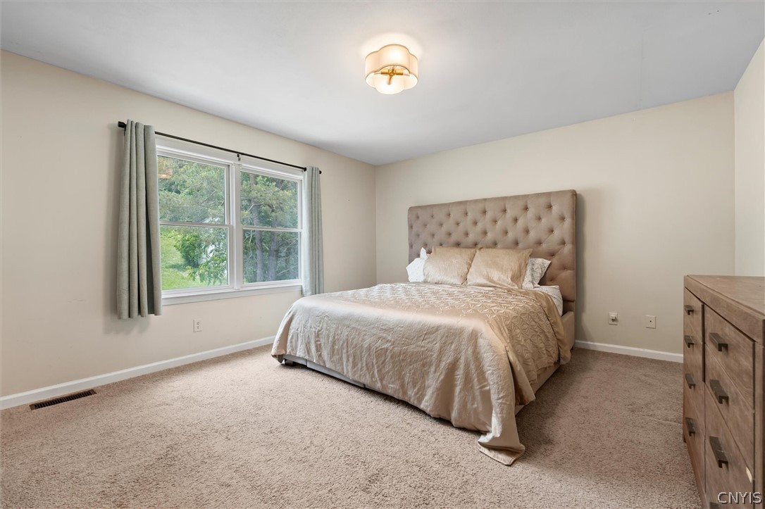 4615 Broad Road Onondaga, NY 13215 - Photo 23 of 47 Spacious primary bedroom retreat.