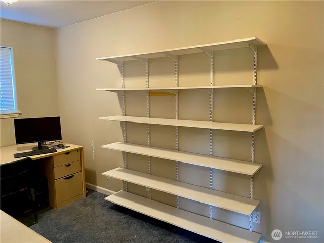 a view of a room with a window and a curtain