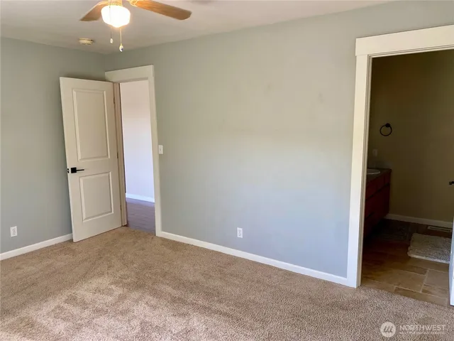 a bathroom with a shower and a sink