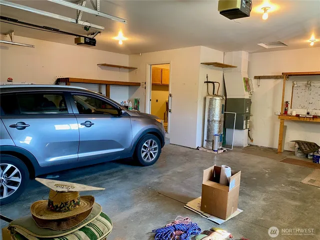 a view of a patio with table and chairs potted plants with wooden fence