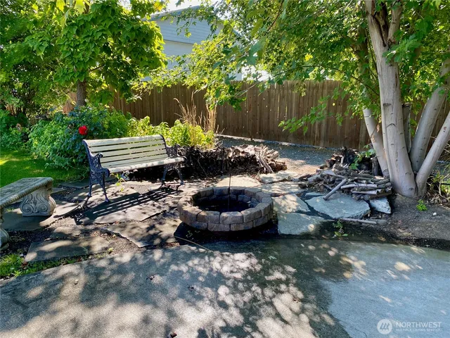 a front view of a house with yard and green space