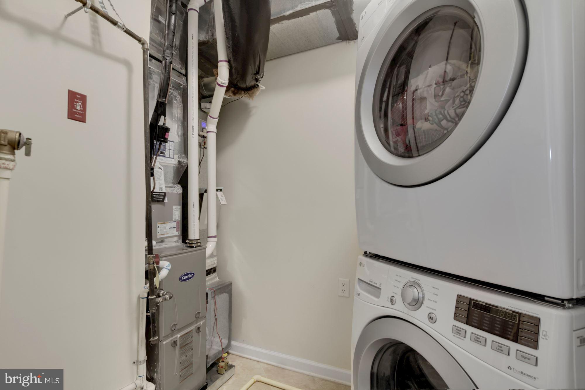 3825 Doc Berlin Drive, Unit 17 Silver Spring, MD 20906 - Photo 27 of 34 a utility room with dryer and washer