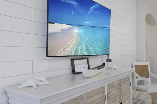a view of a dining room with furniture and a potted plant