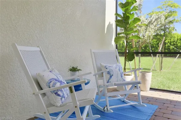 a bedroom with a bed and a ceiling fan