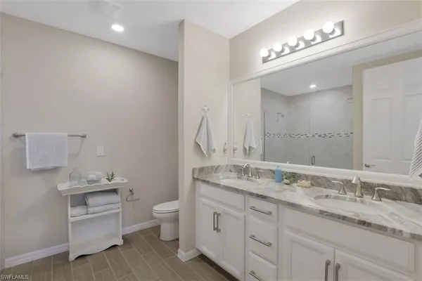 a bedroom with two beds and a window