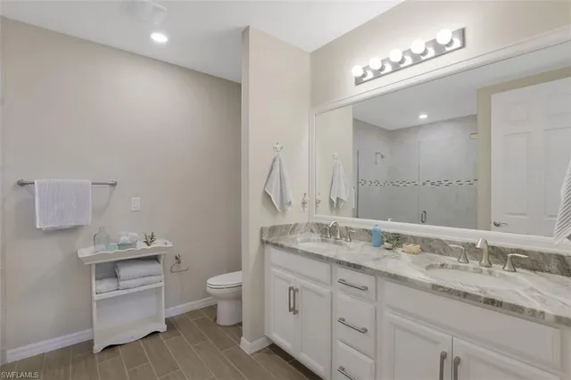 a bedroom with two beds and a window