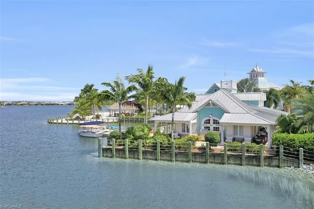 a view of swimming pool with a table and chairs