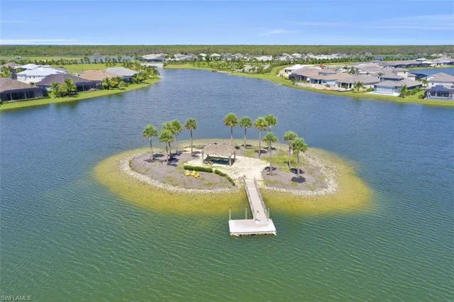 a balcony with furniture and a lake view