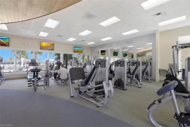 a view of a pool with a table and chairs