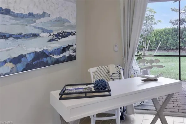 a view of a dining room with furniture and window