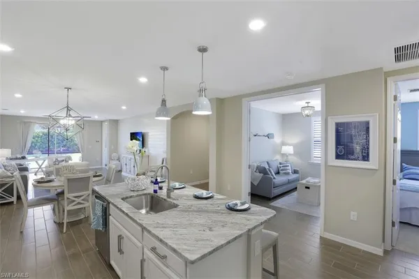 a kitchen with granite countertop living room and living room
