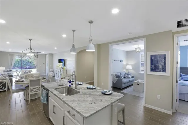 a kitchen with granite countertop living room and living room