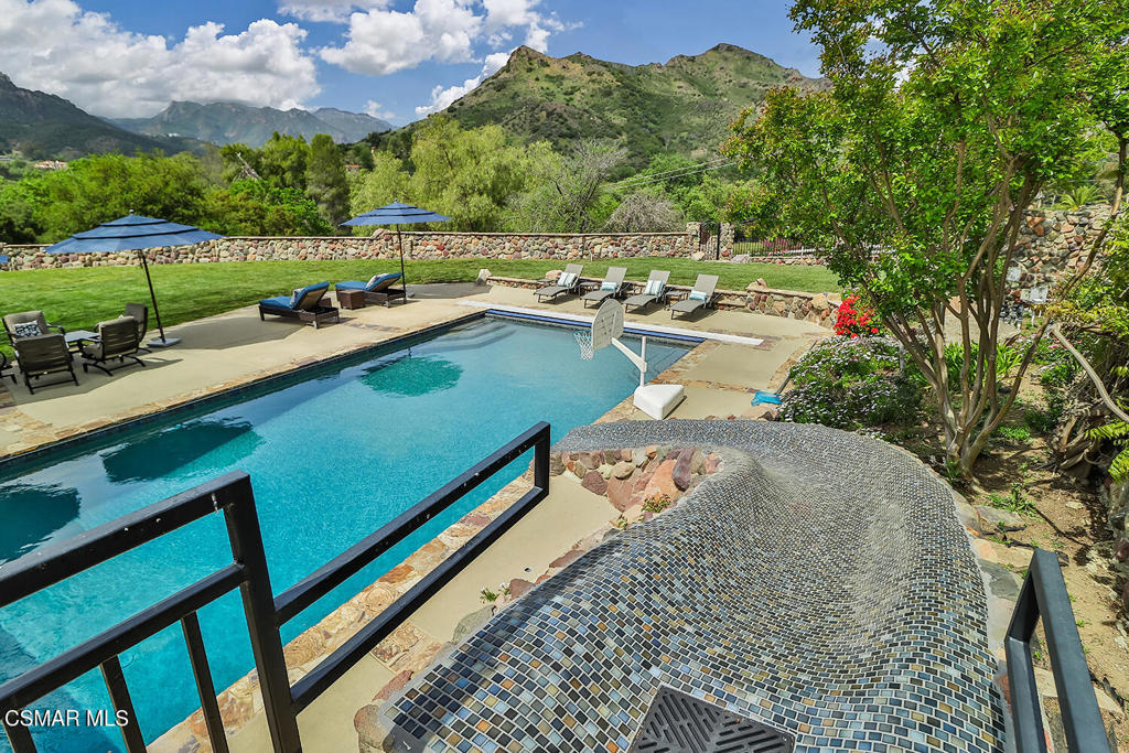 3030 Triunfo Canyon Road Agoura Hills, CA 91301 - Photo 14 of 50 a picture of a yard with table and chairs