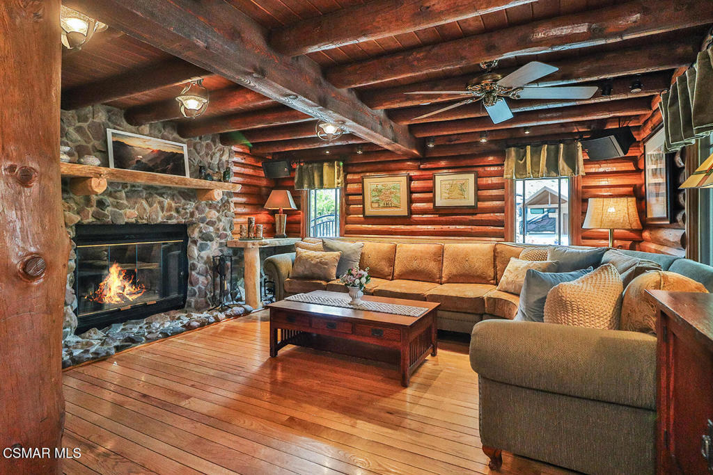 3030 Triunfo Canyon Road Agoura Hills, CA 91301 - Photo 19 of 50 a living room with furniture and a fireplace