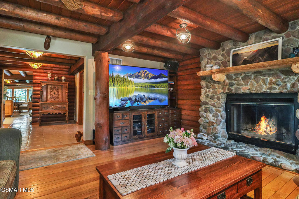 3030 Triunfo Canyon Road Agoura Hills, CA 91301 - Photo 20 of 50 a living room with fireplace furniture and a wooden floor