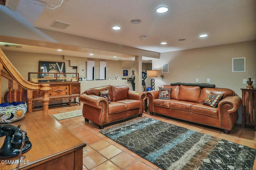3030 Triunfo Canyon Road Agoura Hills, CA 91301 - Photo 25 of 50 a living room with furniture and a flat screen tv