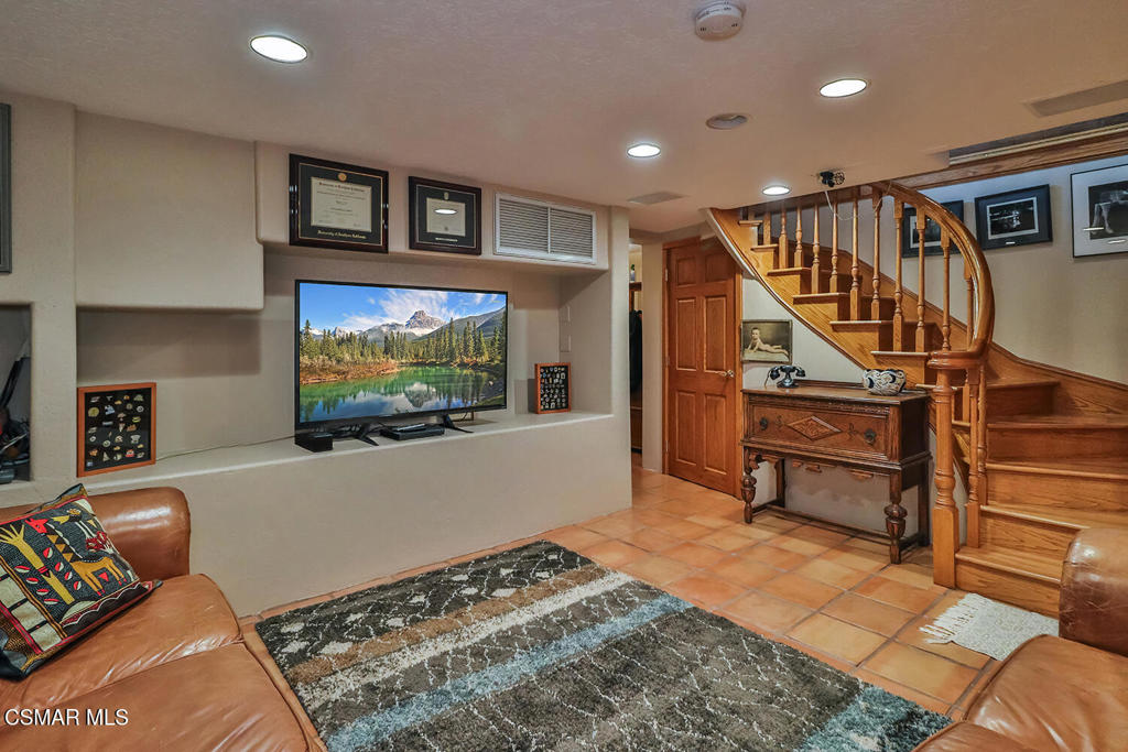 3030 Triunfo Canyon Road Agoura Hills, CA 91301 - Photo 26 of 50 a living room with furniture and a flat screen tv