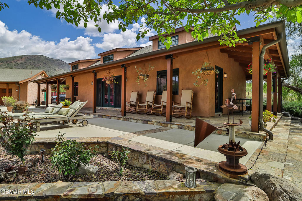3030 Triunfo Canyon Road Agoura Hills, CA 91301 - Photo 35 of 50 a view of a house with sitting area and furniture